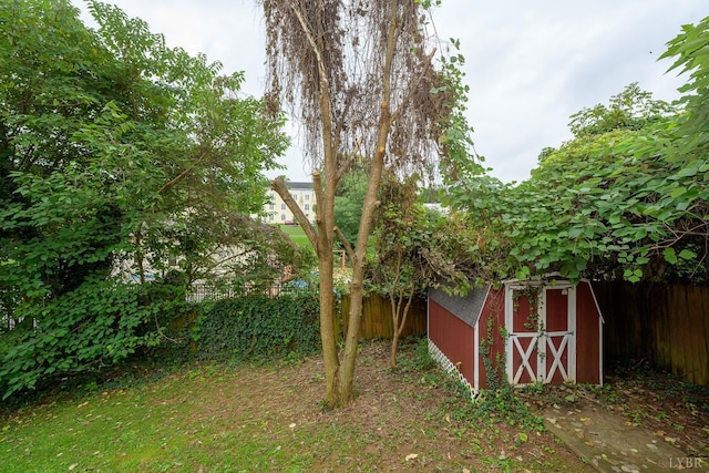 906 8th St, Lynchburg, VA 24504 - view of yard with a storage unit, fence, and an outbuilding