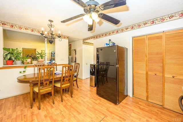906 8th St, Lynchburg, VA 24504 - dining area featuring light wood-style floors, a ceiling fan, and a chandelier