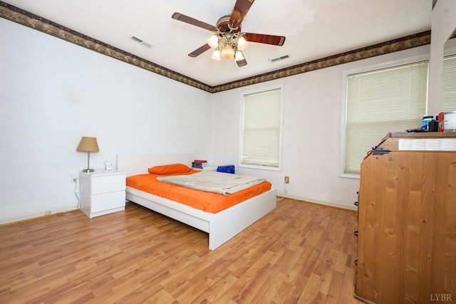 906 8th St, Lynchburg, VA 24504 - bedroom with light wood-type flooring, baseboards, and a ceiling fan
