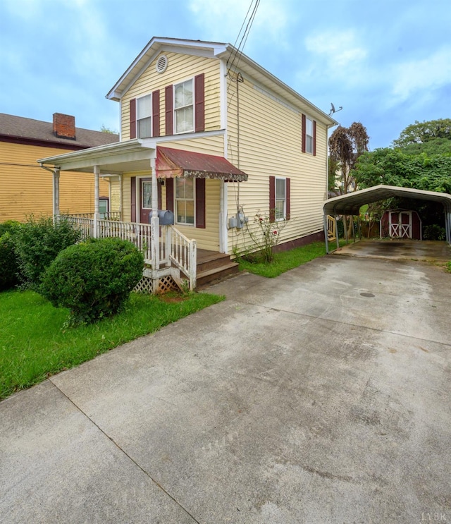906 8th St, Lynchburg, VA 24504 - view of front of house featuring covered porch, a detached carport, and driveway