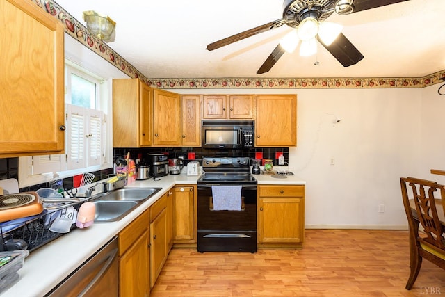 906 8th St, Lynchburg, VA 24504 - kitchen with black appliances, a sink, light wood-style flooring, light countertops, and ceiling fan