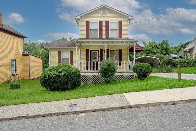906 8th St, Lynchburg, VA 24504 - traditional home featuring covered porch, a front lawn, and a detached carport