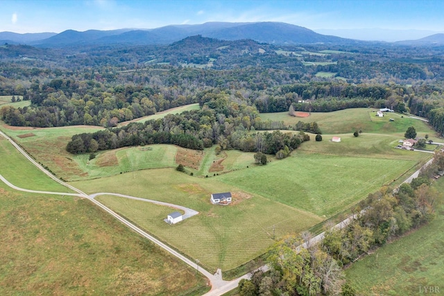 birds eye view of property with a mountain view and a rural view