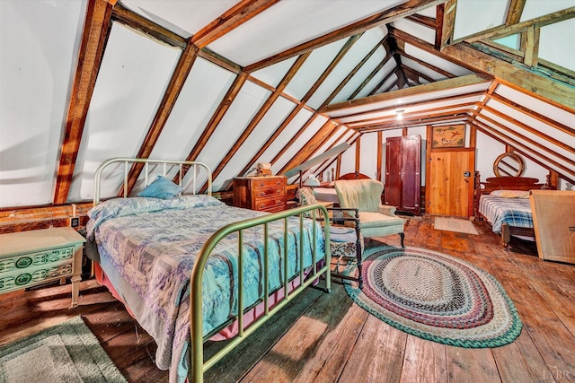 bedroom with lofted ceiling, dark hardwood / wood-style floors, and wood walls