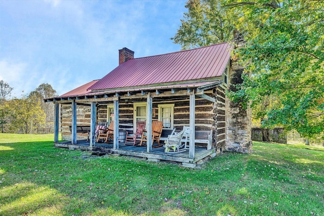 1155 Gaston Rd, Vinton, VA 24179 - rear view of house with a chimney, a yard, and metal roof