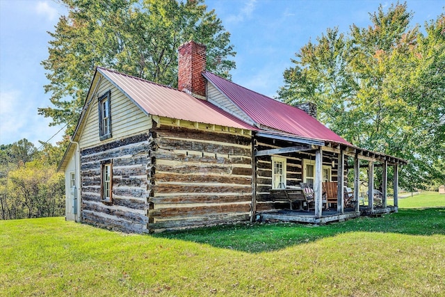1155 Gaston Rd, Vinton, VA 24179 - view of property exterior featuring a chimney, a lawn, and metal roof
