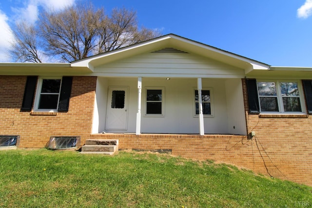 5427 Snake Creek Rd, Stuart, VA 24343 - view of front of house with a front yard, covered porch, and brick siding