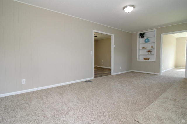 5427 Snake Creek Rd, Stuart, VA 24343 - carpeted empty room with baseboards and built in shelves
