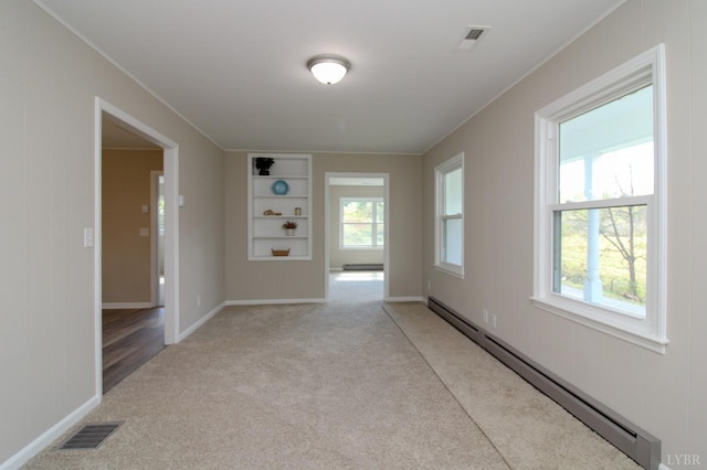 5427 Snake Creek Rd, Stuart, VA 24343 - spare room featuring crown molding, visible vents, light carpet, and a baseboard radiator