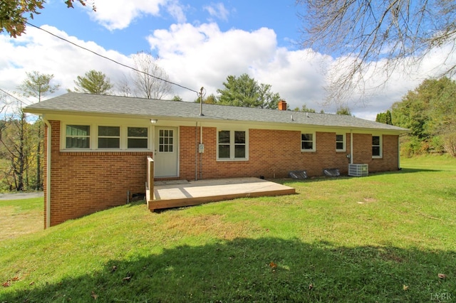 5427 Snake Creek Rd, Stuart, VA 24343 - rear view of property featuring a chimney, a yard, brick siding, a wooden deck, and cooling unit