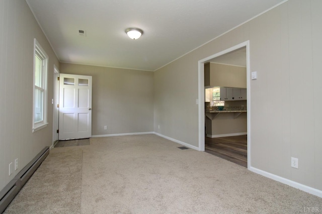5427 Snake Creek Rd, Stuart, VA 24343 - carpeted spare room with ornamental molding, visible vents, baseboards, and a baseboard radiator