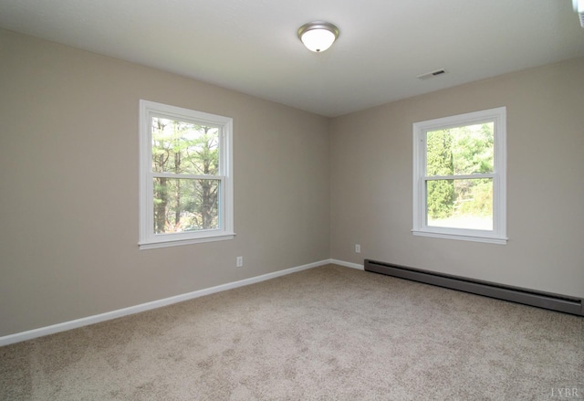 5427 Snake Creek Rd, Stuart, VA 24343 - carpeted empty room with visible vents, baseboard heating, and baseboards