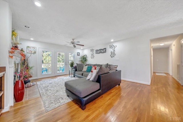 1746 Fiddler Creek Rd, Bedford, VA 24523 - living room with a textured ceiling, light hardwood / wood-style flooring, and ceiling fan