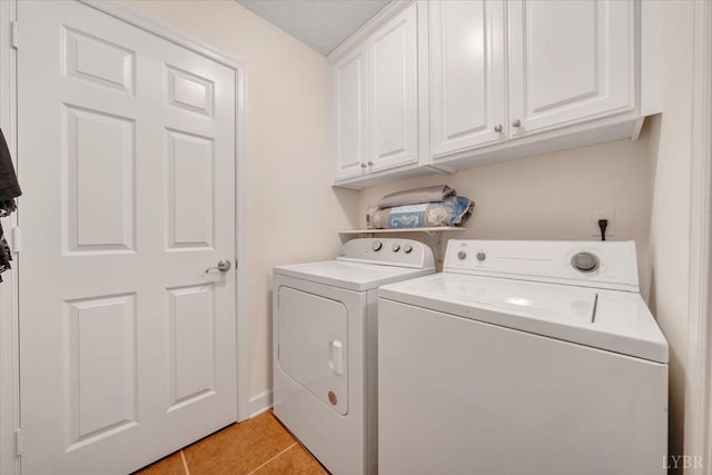 1746 Fiddler Creek Rd, Bedford, VA 24523 - clothes washing area with cabinets, washing machine and dryer, and light tile patterned floors