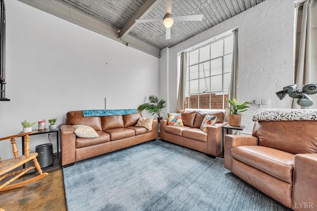 400 SW Salem Ave Unit 2B, Roanoke, VA 24016 - living area featuring concrete floors, a ceiling fan, beam ceiling, brick wall, and wooden ceiling