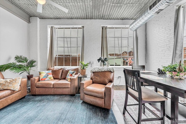 400 SW Salem Ave Unit 2B, Roanoke, VA 24016 - living room with a ceiling fan and brick wall