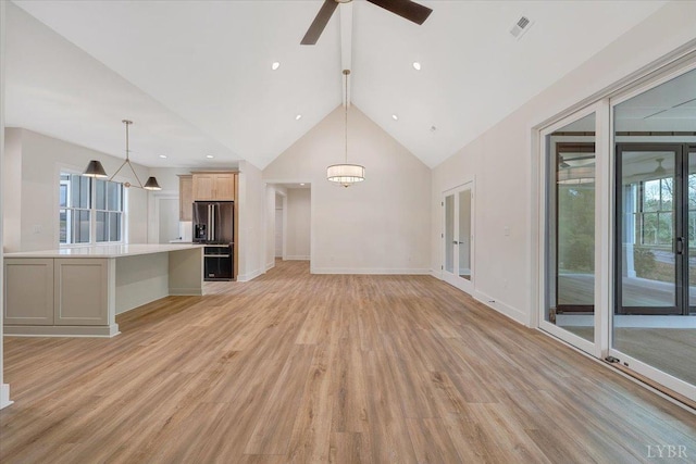 1161 Golf View Ct, Huddleston, VA 24104 - unfurnished living room with light wood-style floors, high vaulted ceiling, ceiling fan, baseboards, and a chandelier