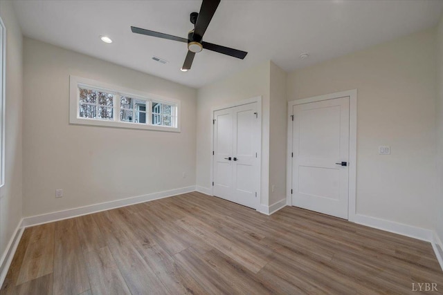 1161 Golf View Ct, Huddleston, VA 24104 - unfurnished bedroom featuring wood finished floors, baseboards, ceiling fan, a closet, and recessed lighting