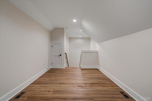 1161 Golf View Ct, Huddleston, VA 24104 - bonus room featuring lofted ceiling, wood finished floors, baseboards, and recessed lighting