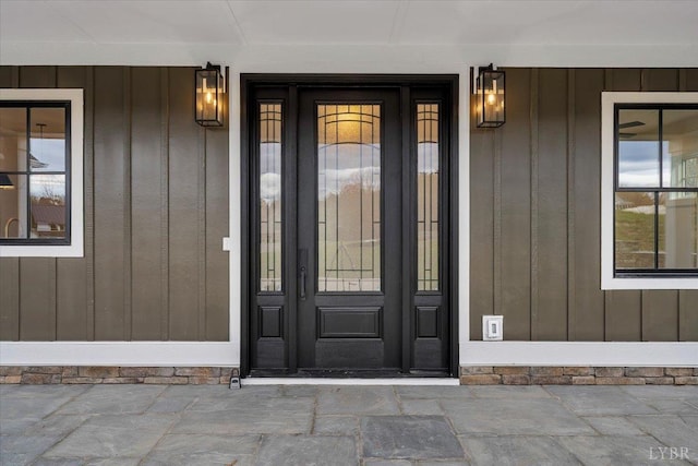 1161 Golf View Ct, Huddleston, VA 24104 - doorway to property with board and batten siding and covered porch