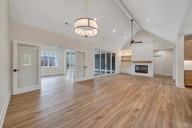 1161 Golf View Ct, Huddleston, VA 24104 - unfurnished living room with baseboards, beam ceiling, a large fireplace, light wood-type flooring, and high vaulted ceiling