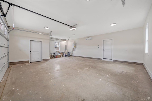 1161 Golf View Ct, Huddleston, VA 24104 - garage featuring a garage door opener, strapped water heater, recessed lighting, and baseboards