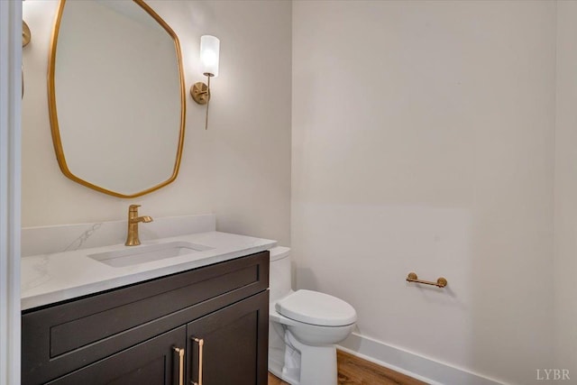 1161 Golf View Ct, Huddleston, VA 24104 - half bathroom with toilet, vanity, wood finished floors, and baseboards