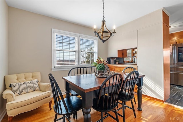 2180 Lime Plant Rd, Appomattox, VA 24522 - dining room with a chandelier, light wood-style floors, and baseboards