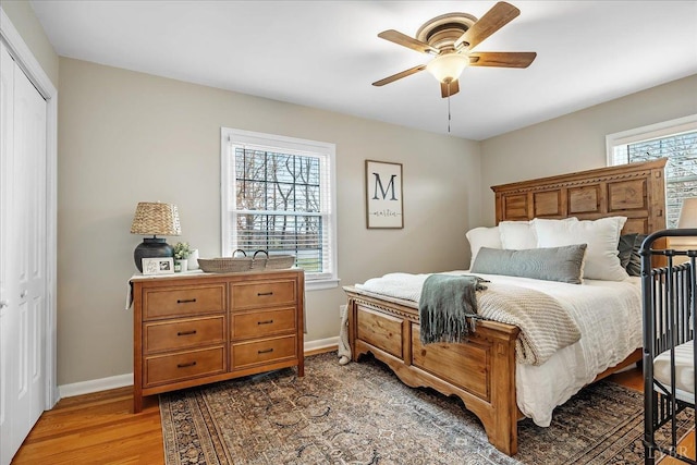 2180 Lime Plant Rd, Appomattox, VA 24522 - bedroom with multiple windows, light wood finished floors, baseboards, and a closet