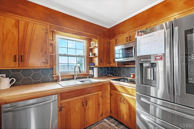 2180 Lime Plant Rd, Appomattox, VA 24522 - kitchen with stainless steel appliances, a sink, decorative backsplash, butcher block counters, and brown cabinets