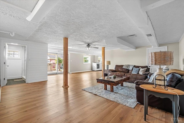 2180 Lime Plant Rd, Appomattox, VA 24522 - living area featuring wood finished floors, a textured ceiling, a ceiling fan, and healthy amount of natural light