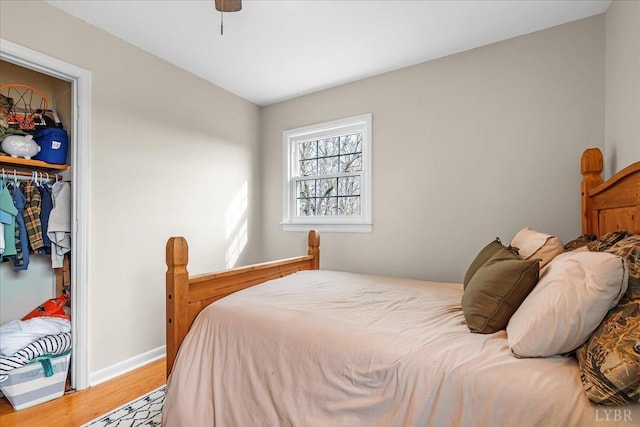 2180 Lime Plant Rd, Appomattox, VA 24522 - bedroom with light wood-type flooring, a closet, baseboards, and a ceiling fan