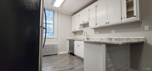 4065 Fort Ave, Lynchburg, VA 24502 - kitchen with radiator heating unit, appliances with stainless steel finishes, a sink, and plenty of natural light