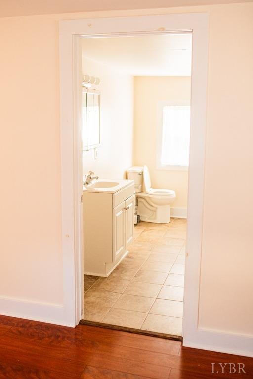 67 Lentz Ln, Shipman, VA 22971 - half bath with vanity, wood finished floors, toilet, and baseboards