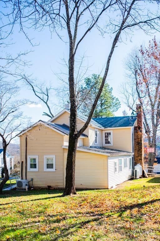 67 Lentz Ln, Shipman, VA 22971 - view of home's exterior featuring a chimney, a lawn, and ac unit
