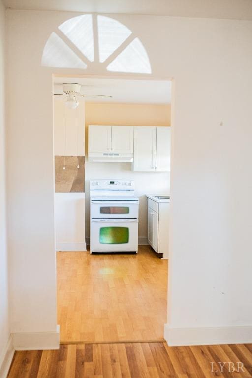 67 Lentz Ln, Shipman, VA 22971 - kitchen featuring white electric range, extractor fan, white cabinets, and light wood-type flooring