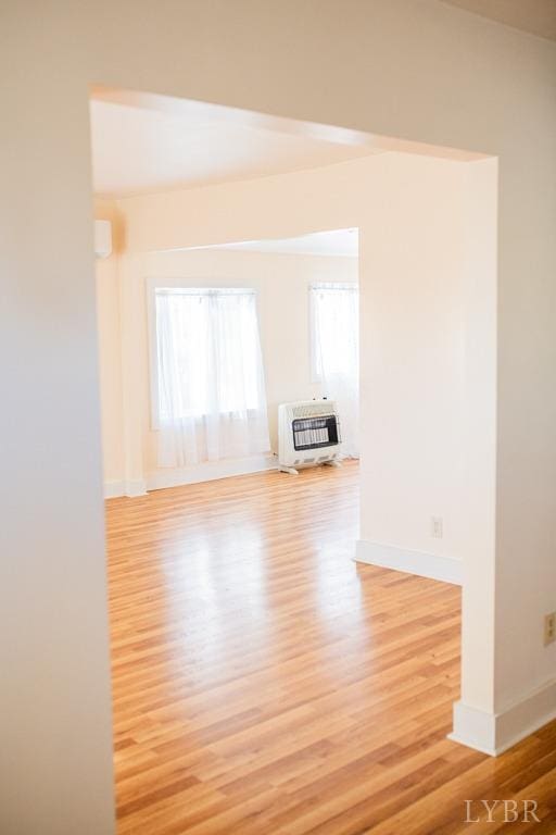 67 Lentz Ln, Shipman, VA 22971 - unfurnished living room with heating unit, light wood finished floors, and baseboards