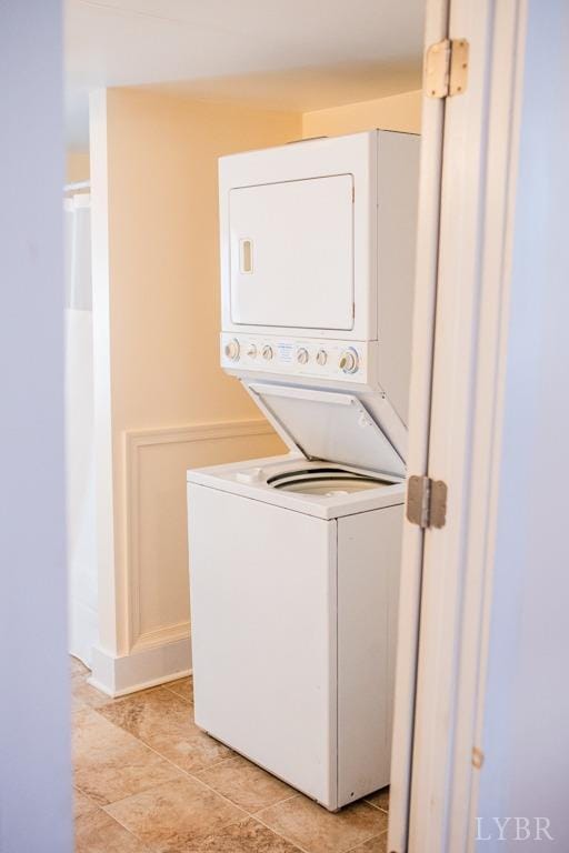 67 Lentz Ln, Shipman, VA 22971 - washroom featuring estacked washer and dryer and light tile patterned floors