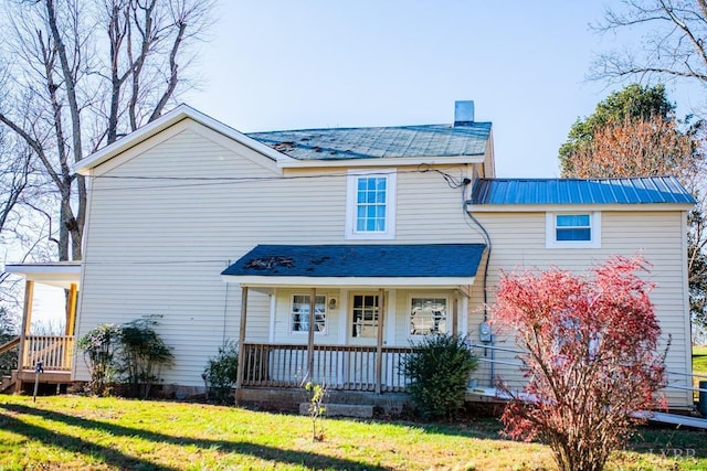 67 Lentz Ln, Shipman, VA 22971 - traditional home with a front lawn, covered porch, a chimney, and metal roof