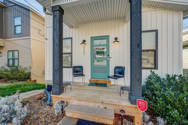 3047 Fulton St, Lynchburg, VA 24501 - property entrance featuring covered porch and board and batten siding