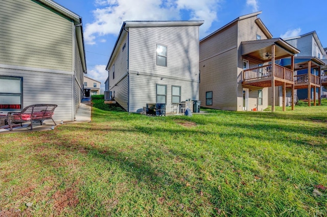 3047 Fulton St, Lynchburg, VA 24501 - rear view of property featuring central AC, a yard, and a ceiling fan