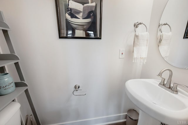 3047 Fulton St, Lynchburg, VA 24501 - half bathroom featuring a sink, toilet, and baseboards