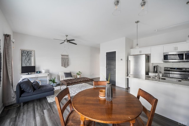 3047 Fulton St, Lynchburg, VA 24501 - dining area featuring ceiling fan, dark wood-style flooring, and baseboards