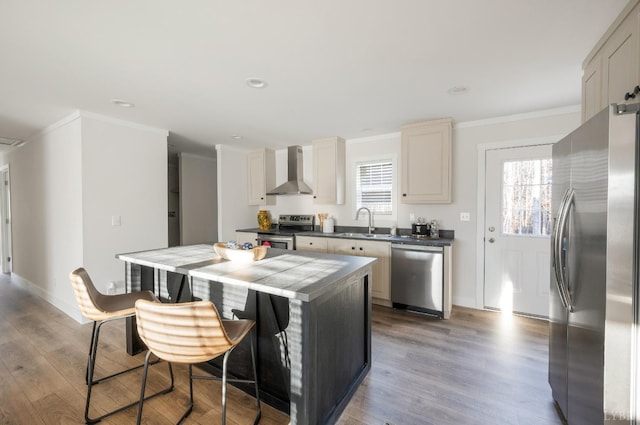 899 Union Hill Rd, Amherst, VA 24521 - kitchen with stainless steel appliances, wall chimney range hood, crown molding, a kitchen island, and wood finished floors