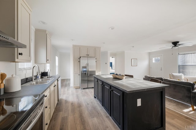 899 Union Hill Rd, Amherst, VA 24521 - kitchen with appliances with stainless steel finishes, wall chimney range hood, light wood-style flooring, a center island, and ceiling fan