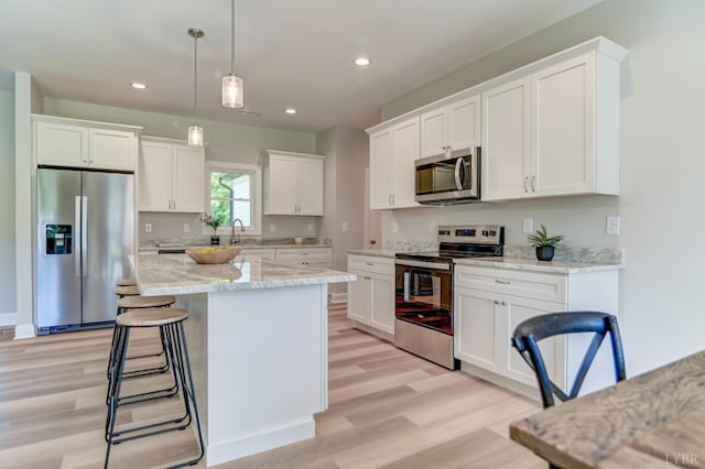 1327 Greenhouse Rd, Rustburg, VA 24588 - kitchen with white cabinetry, stainless steel appliances, light wood-style flooring, and recessed lighting