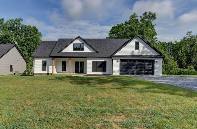 1327 Greenhouse Rd, Rustburg, VA 24588 - modern farmhouse style home with an attached garage, gravel driveway, a front lawn, board and batten siding, and central AC unit