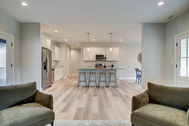 1327 Greenhouse Rd, Rustburg, VA 24588 - living room with baseboards, light wood finished floors, recessed lighting, and visible vents