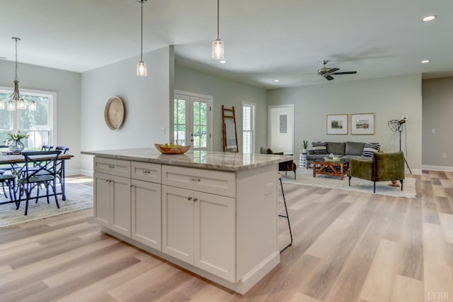 1327 Greenhouse Rd, Rustburg, VA 24588 - kitchen featuring a healthy amount of sunlight, light wood finished floors, recessed lighting, and a kitchen island