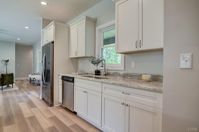 1327 Greenhouse Rd, Rustburg, VA 24588 - kitchen featuring a sink, freestanding refrigerator, white cabinetry, dishwasher, and light wood-style floors